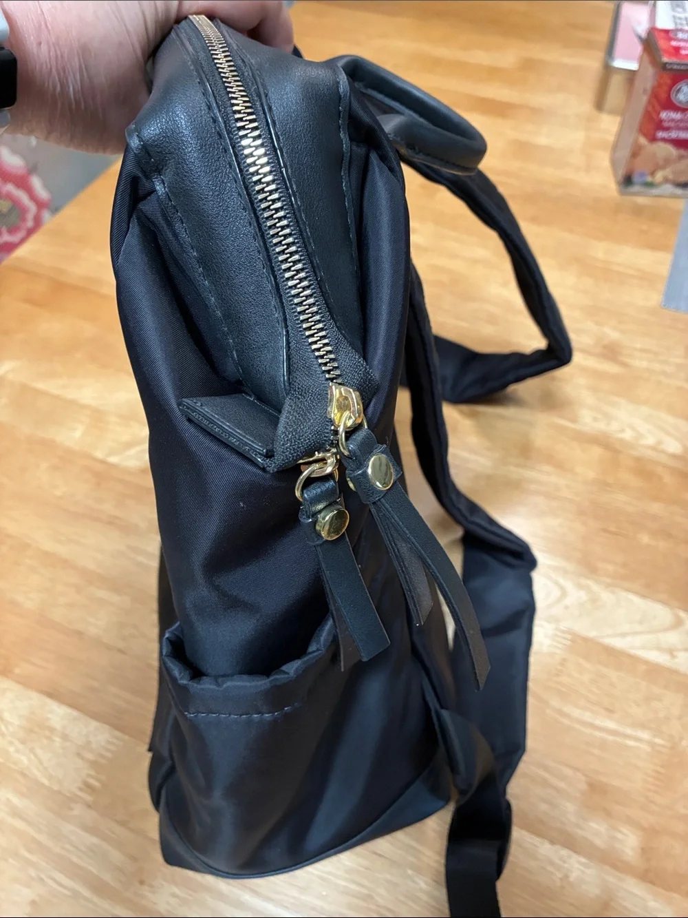 Tutilo Black Men's Backpack with Gold Zipper Accents
